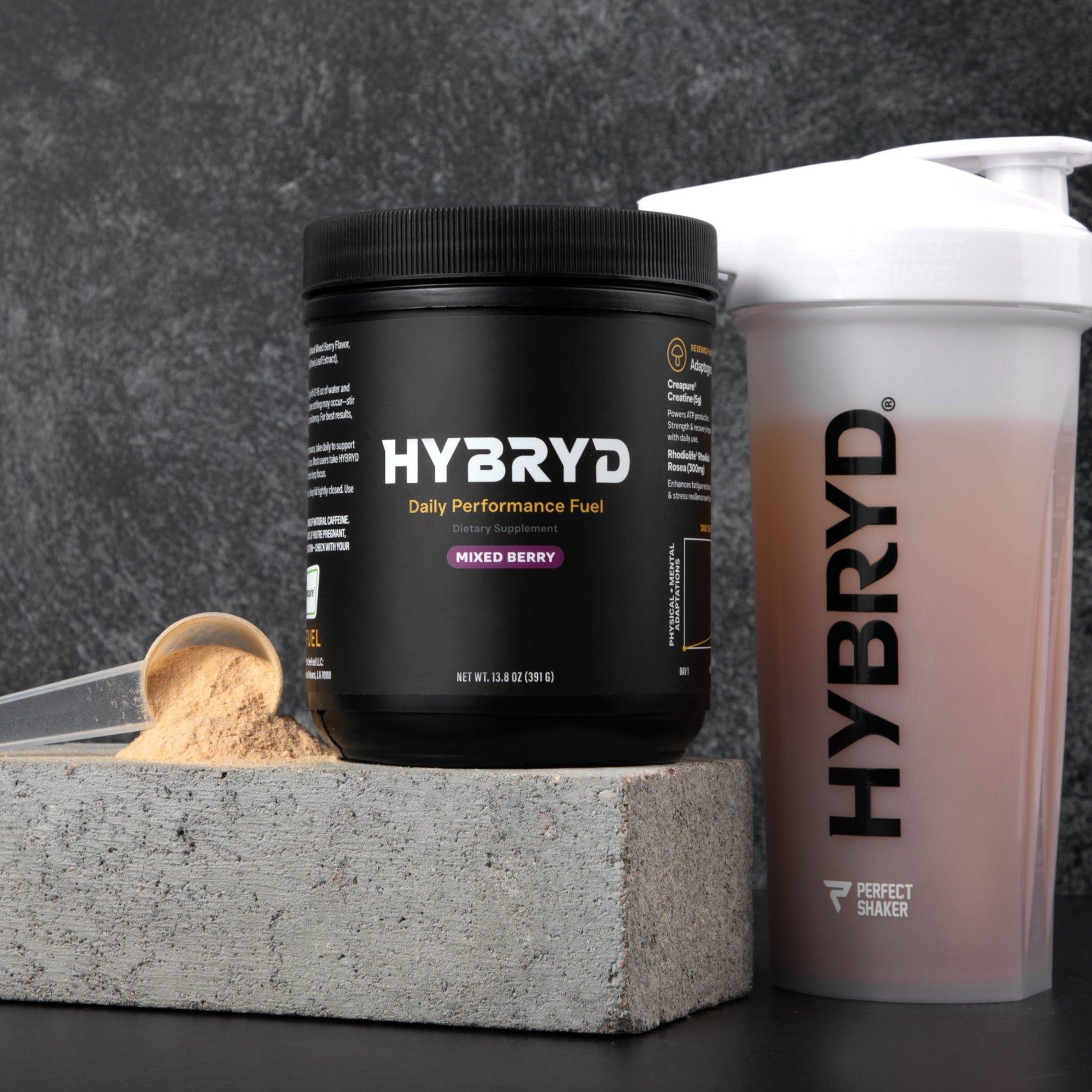HYBRYD powder container and shaker bottle on a dark background